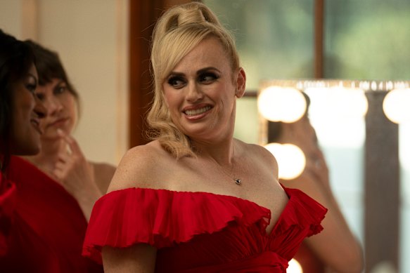 Rebel Wilson is a spy masquerading as someone who designs plinths for cat shows in Bride Hard.