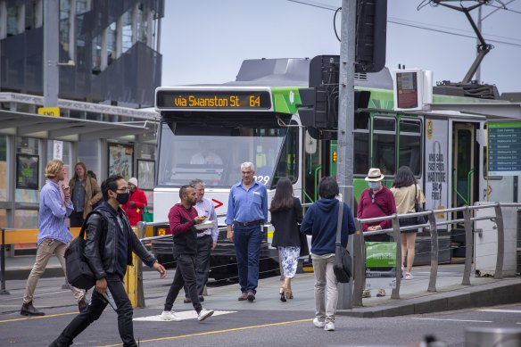 Commuters outside Melbourne’s Flinders Street Station on Monday.