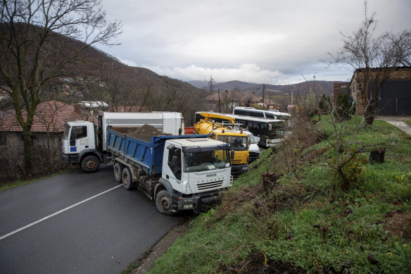 Heavy vehicles parked by local Serbs block the road in the village of Rudare, northern Kosovo.