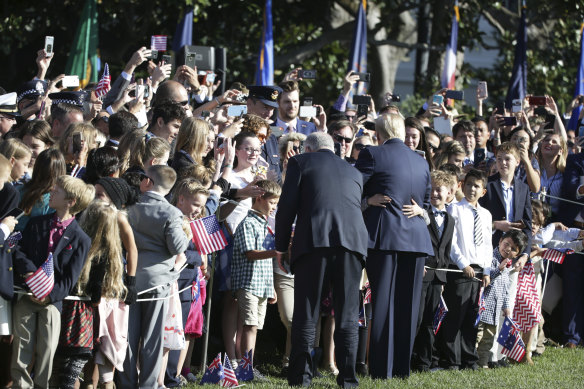 The two leaders greet visitors at the White House during the ceremonial welcome.