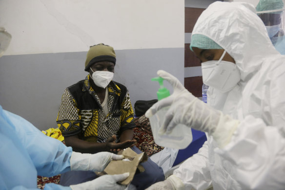 A COVID-19 patient is treated in N’Djamena, Chad. While the world’s wealthier nations have stockpiled coronavirus vaccines for their citizens, many poorer countries are scrambling to secure enough doses.