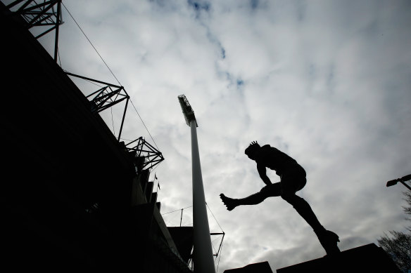 The bronze statue of Barassi outside the MCG, unveiled in 2003.