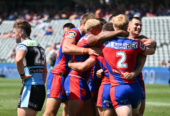 Knights celebrate after scoring against the Sharks.