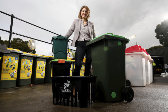 Danae Bosler, mayor of Yarra Council, with the bins from the council's trial of a new approach to household waste.