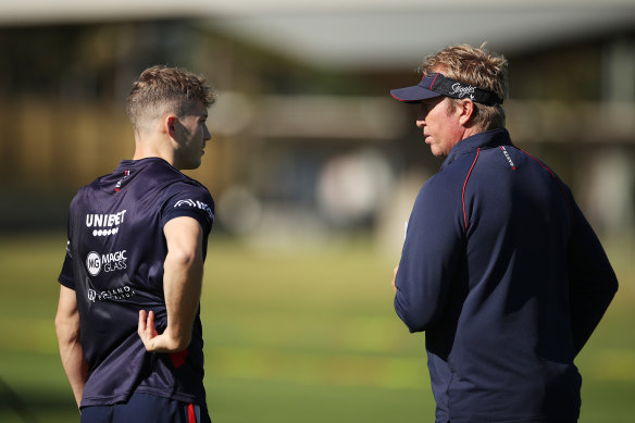 Sam Walker and Robinson in discussion at training.