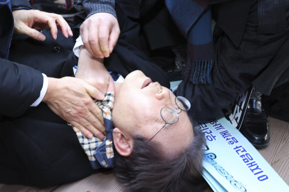 South Korean opposition leader Lee Jae-myung after he was stabbed in the neck.