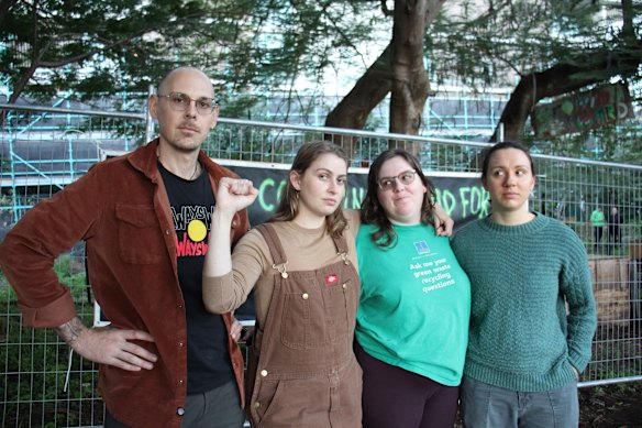 Kurilpa Commons members Shane Cucow, Jemika Lancaster and Jess Wallace were in the gardens on Monday as police and government workers fenced off the garden. 