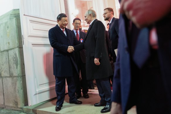 Chinese President Xi Jinping shakes hands with Russian President Vladimir Putin after dinner in the Kremlin in March.