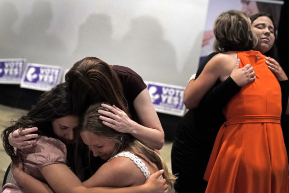 People hug during a Value Them Both watch party in Overland Park after a question involving a constitutional amendment to remove abortion protections from the Kansas constitution failed.