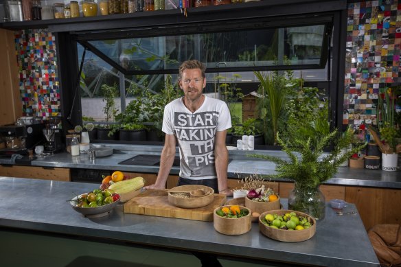 The project's producer, Joost Bakker, in the kitchen, which has tiles made from skateboards.