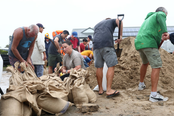 People fill sandbags on Wednesday in Tugun at the Gold Coast.