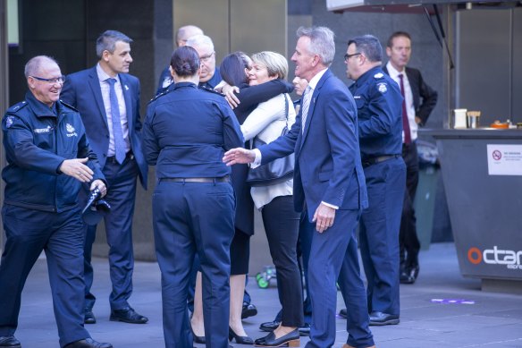 Family members gather outside court ahead of the sentencing.