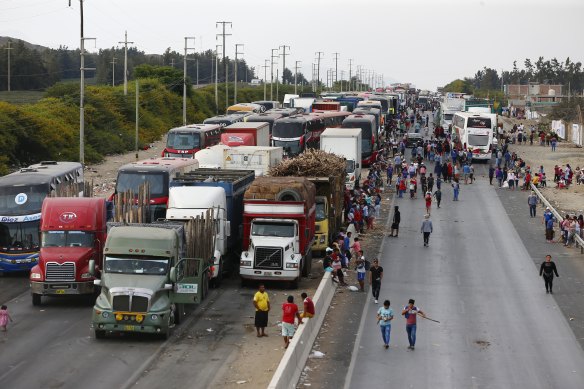 Trucks and buses are stuck on the Pan-American highway because of road blocks by supporters of ousted Peruvian president Pedro Castillo, in Chao, Peru.