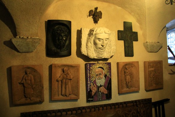 A crucifix and statue of Christ.
