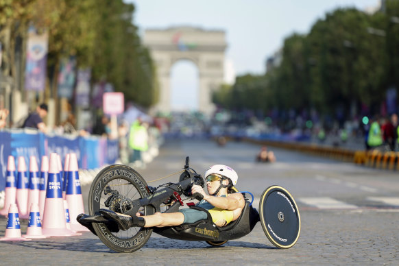 Lauren Parker makes her way down the Champs-Elysees in the triathlon.