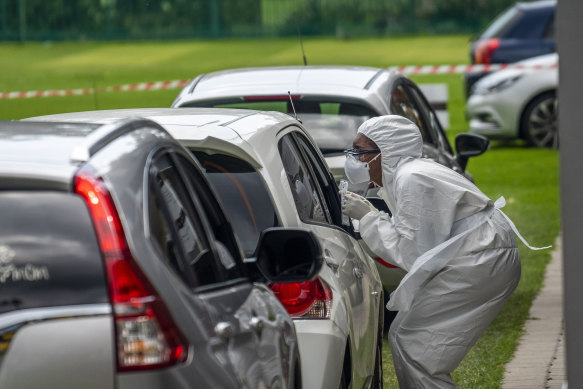 Cars line up at a private COVID-19 testing station in the northern suburbs of Johannesburg, South Africa.