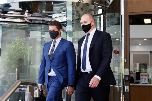 Former National Covid commission chair Nev Power (right) leaves Perth Magistrates  court after a sentencing hearing for breaching WA covid regulations.