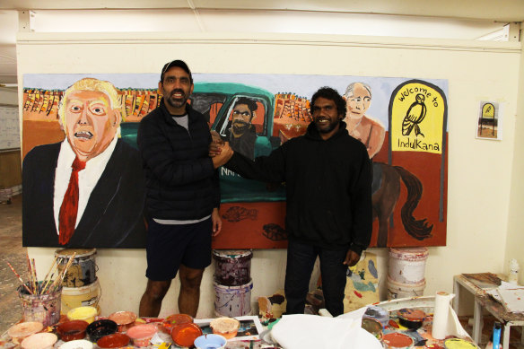 Adam Goodes in Vincent Namatjira’s  Indulkana studio during a tour for the Indigenous Literacy and Numeracy Foundation.