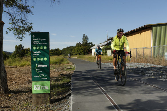 Cyclists ride the Tweed section of the Northern Rivers Rail Trail.