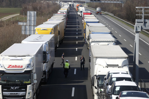 Trucks come to a standstill on a highway close to the border between Austria and Hungary. 