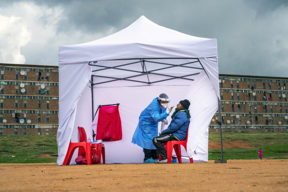 A resident from the Alexandra township gets tested for COVID-19 in Johannesburg, South Africa.