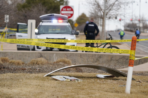 A piece of commercial airplane debris is surrounded by police tape where it landed in Broomfield, Colorado.