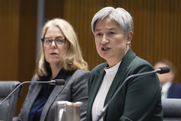 Wong (right), alongside DFAT secretary Jan Adams, during Senate estimates. 