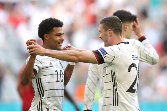 Robin Gosens celebrates his goal with Serge Gnabry.