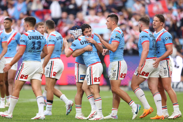 The Roosters celebrate during their win over the Dragons.