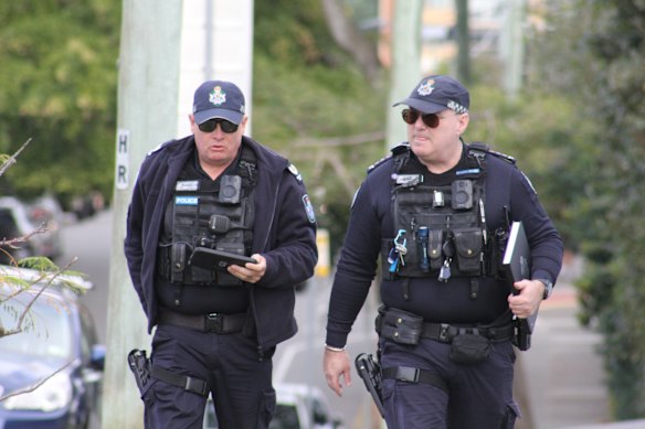 Officers scour the streets after the stabbing.