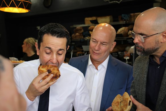 Premier David Crisafulli with Small and Family Business Minister Steve Minnikin and treasurer David Janetzki at Kenrose Bakery in Carina ahead of the distribution of the state budget on Sunday.