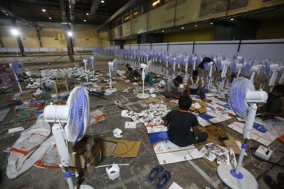 Laborers working to set up at COVID-19 field hospital in Mumbai.