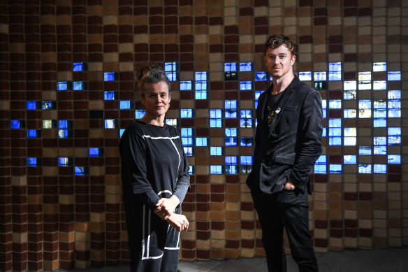 Rose Hiscock, of the University of Melbourne, and Ryan Jefferies, from the Science Gallery, in front of the “digital bricks” at the entrance to the new museum.