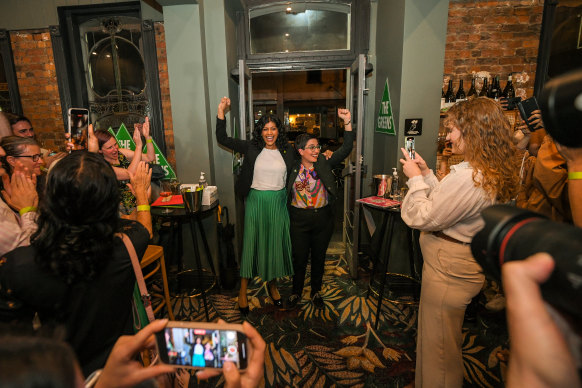 Greens leader Samantha Ratnam and Richmond candidate Gabrielle de Vietri arrive at a Collingwood bar on Saturday night.
