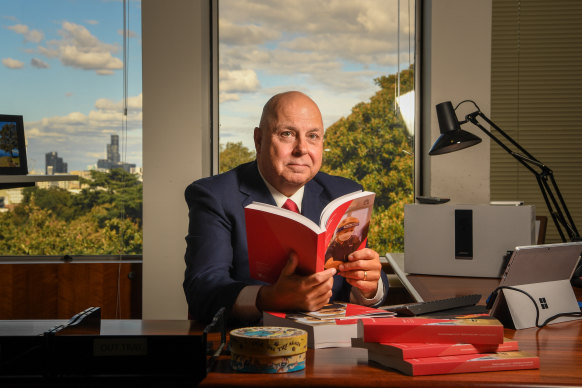 Victorian Treasurer Tim Pallas with last year’s state budget.