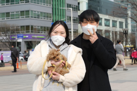 Lee Yeun-hee, 33, a pre-school teacher, and her husband Kim Beom-jin, 34, an office worker joined the campaign rally on Tuesday.