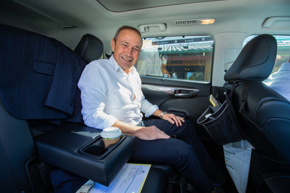 Premier Roger Cook in the back of his Toyota Kluger.