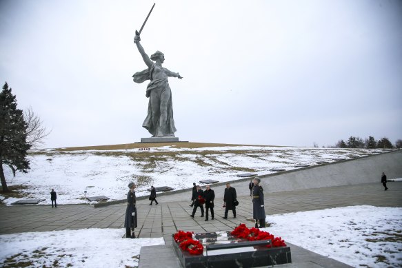 Russian President Vladimir Putin walks to lay a bunch of flowers at the memorial of Marshal of the Soviet Union Vasily Chuikov.