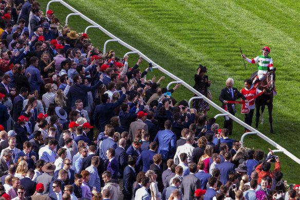 Spectators packed into Moonee Valley for last year's Cox Plate. Martin Pakula has urged the club to put forward a plan for crowds at the All-Star Mile.