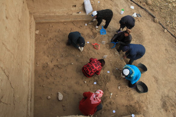 Archaeologists excavate the well-preserved surface at the Xiamabei site in northern China.