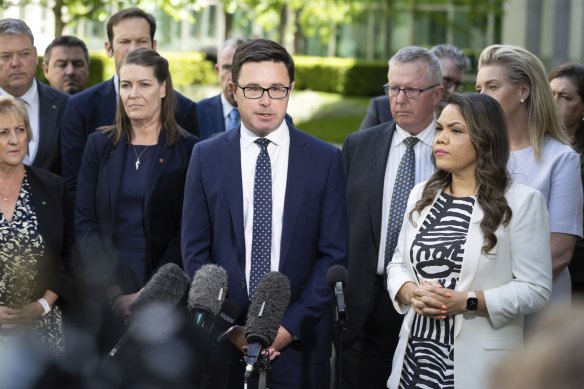 Nationals leader David Littleproud surrounded by his colleagues as they announce their opposition to the Voice referendum.