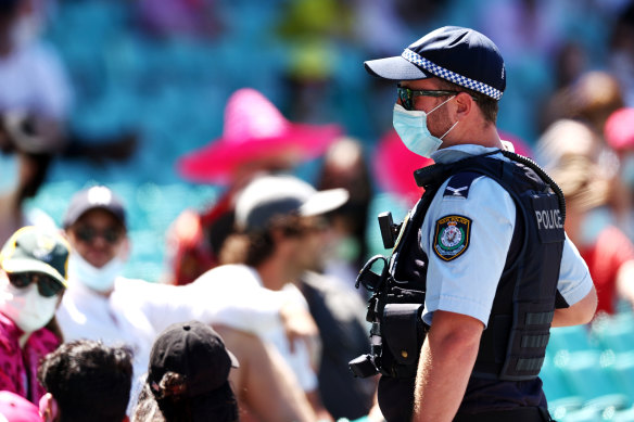 Police speak to spectators following a complaint from Mohammed Siraj of India that stopped play.