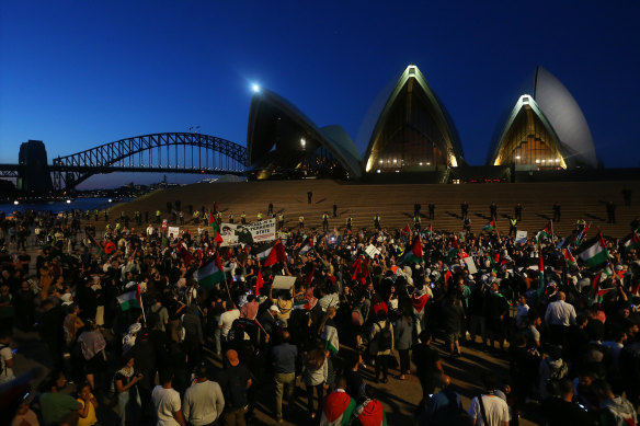 Palestine supporters rally outside the Sydney Opera House on Monday night.