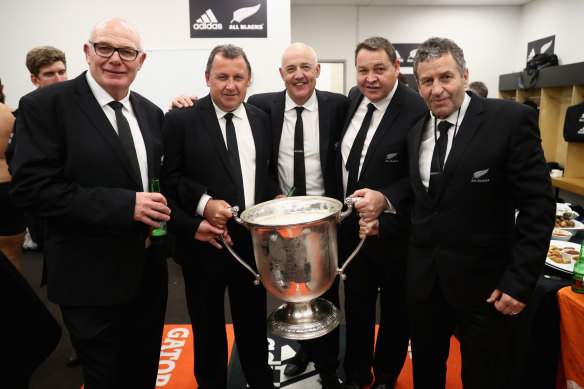 Mike Cron (left) with All Blacks coaches and the Bledisloe Cup in 2016.