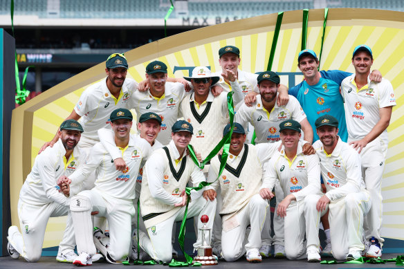 The Australian team poses with the Frank Worrell trophy.