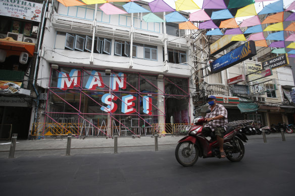 A motorcyclist wearing a face mask to help curb the spread of the coronavirus in Bangkok.