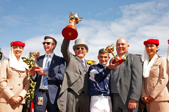 lloyd Williams with trainer Joseph O’Brien and jockey Corey Brown his horse, Rekindling, won the 2017 Melbourne Cup.
