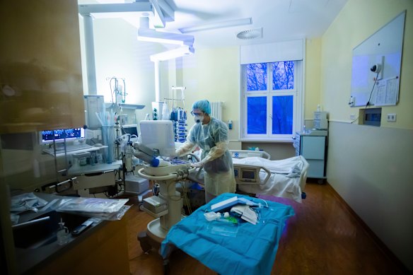 A nurse cares for a COVID-19 patient in the intensive care unit of a Berlin hospital this week.