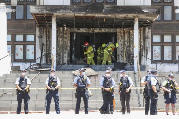 Firefighters and police at the damaged entrance to Old Parliament House on Thursday.