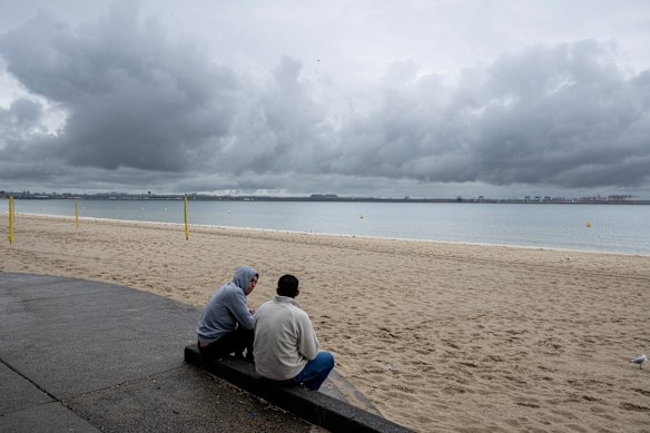 Storm clouds loom over Brighton Le Sands Beach.